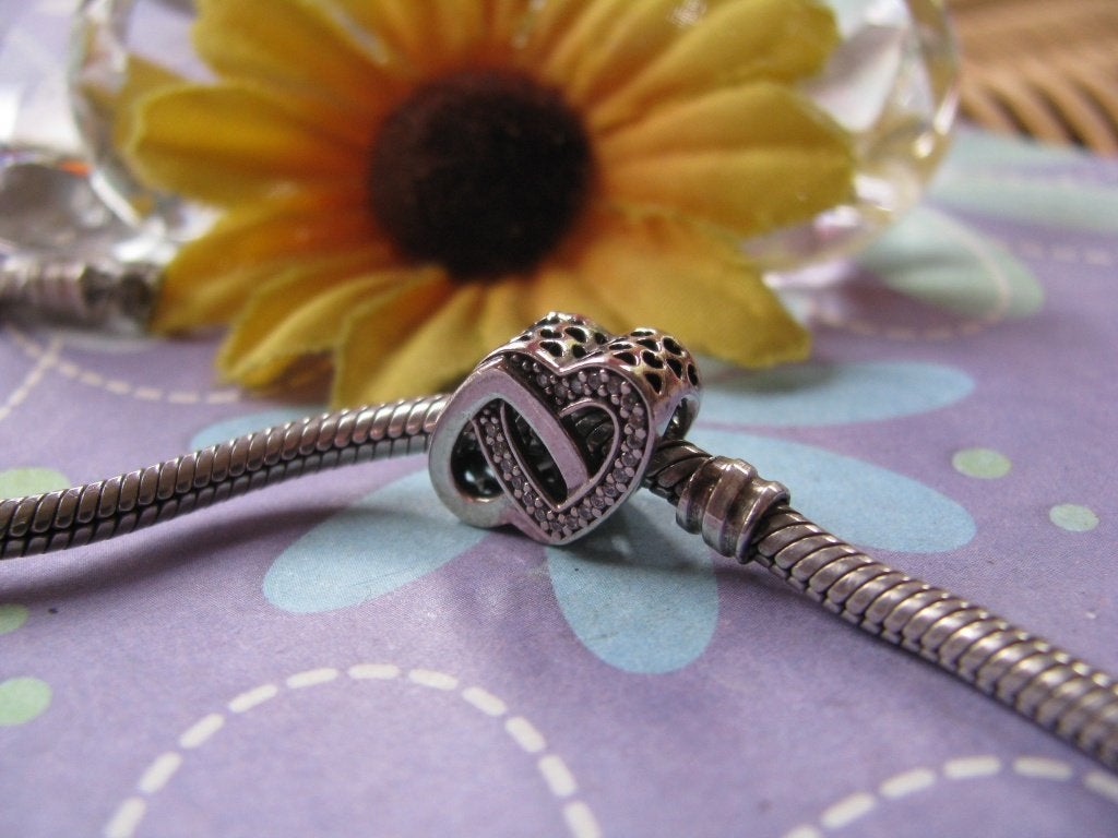 Pandora bedel 791880CZ = verstrengelde harten + zirkoniaas, Pandora, Ophalen of Verzenden, Zo goed als nieuw, 1 bedel