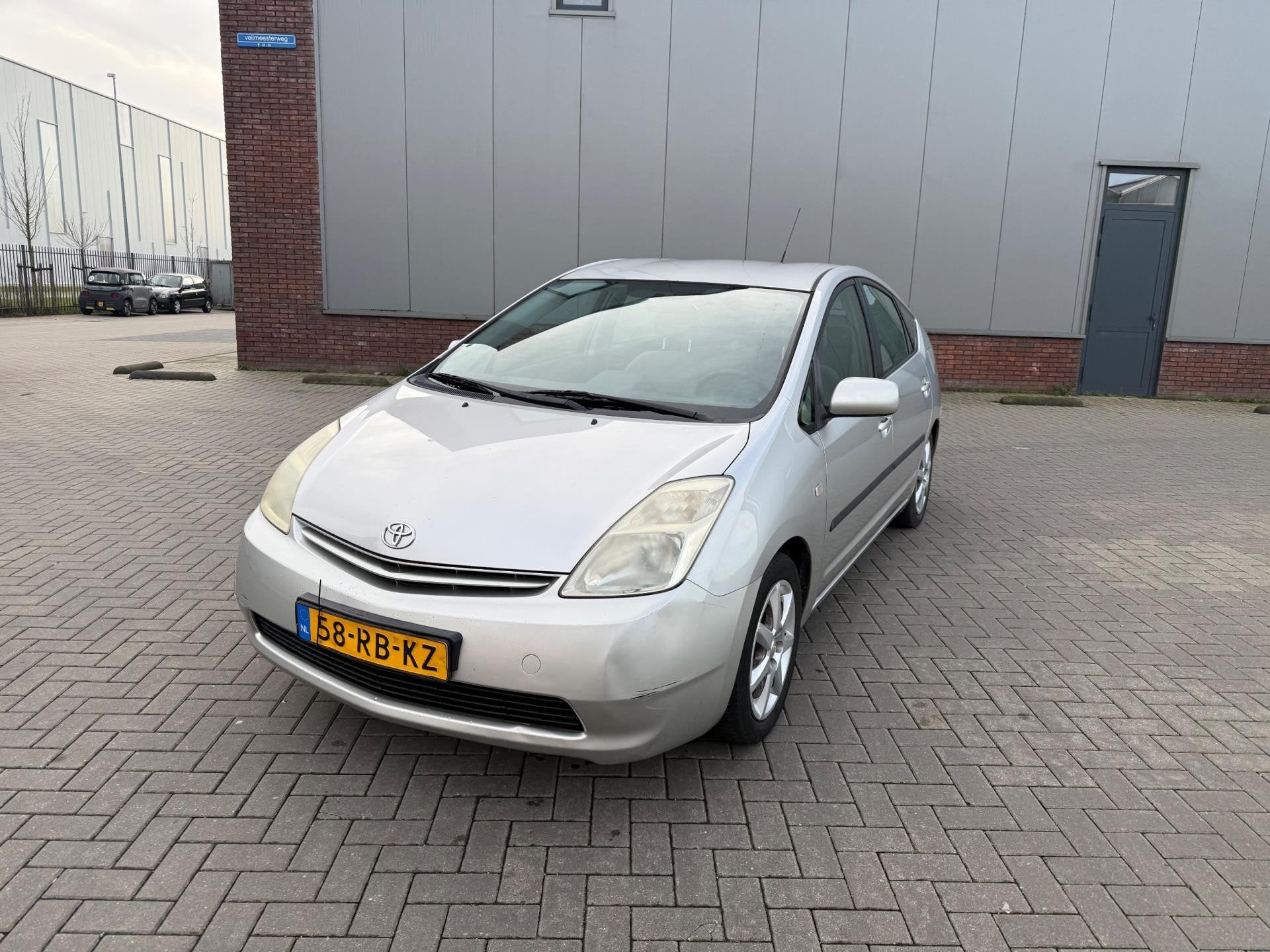 Toyota Prius 1.5 VVT-i Airco Navigatie Grijs 2005, Auto's, 1497 cc, Gebruikt, 23 km/l, Origineel Nederlands
