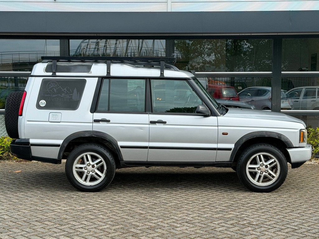 Land Rover Discovery 2.5 Td5 E Imperial NAP APK !, Auto's, Automaat, Zwart, 2495 cc, 139 pk