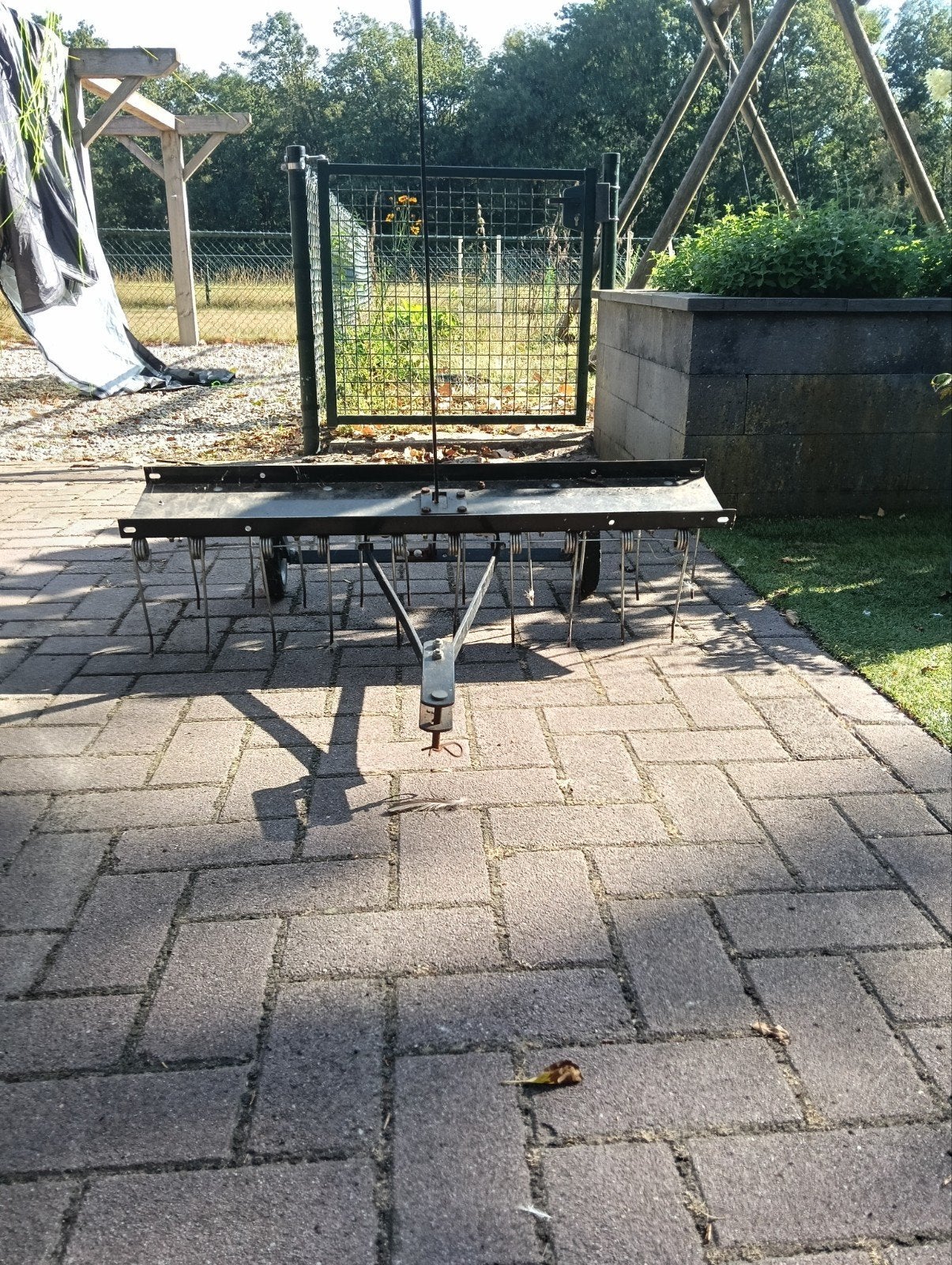 Verticuteermachine/hark voor zitmaaier, Ophalen