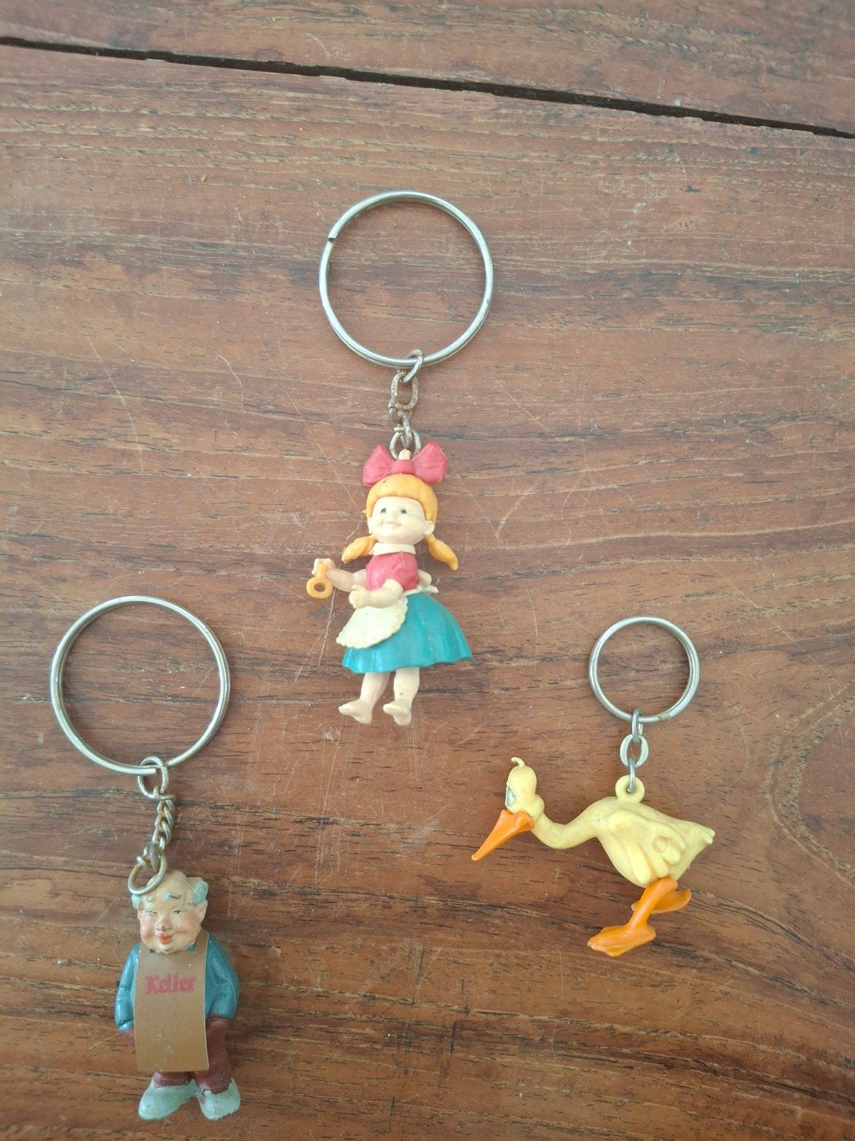 Vintage sleutelhangers: meisje, mannetje, ooievaar, Ophalen, Gebruikt, Knuffel of Figuurtje
