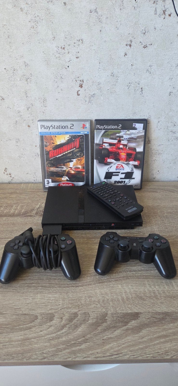 PS2 Slim met afstandsbediening, 2 games en 2 controllers, Spelcomputers en Games, Spelcomputers | Sony PlayStation 2, Zwart, Met 2 controllers