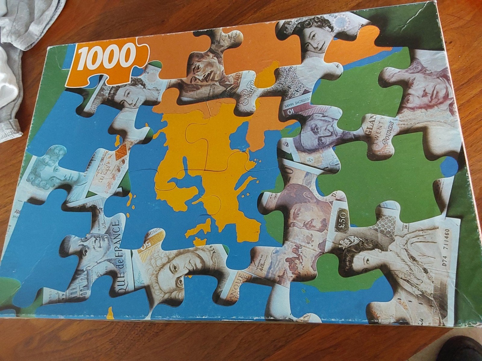 Puzzel 1000 stukjes - Geld van de Wereld (4 stukjes missen), Ophalen