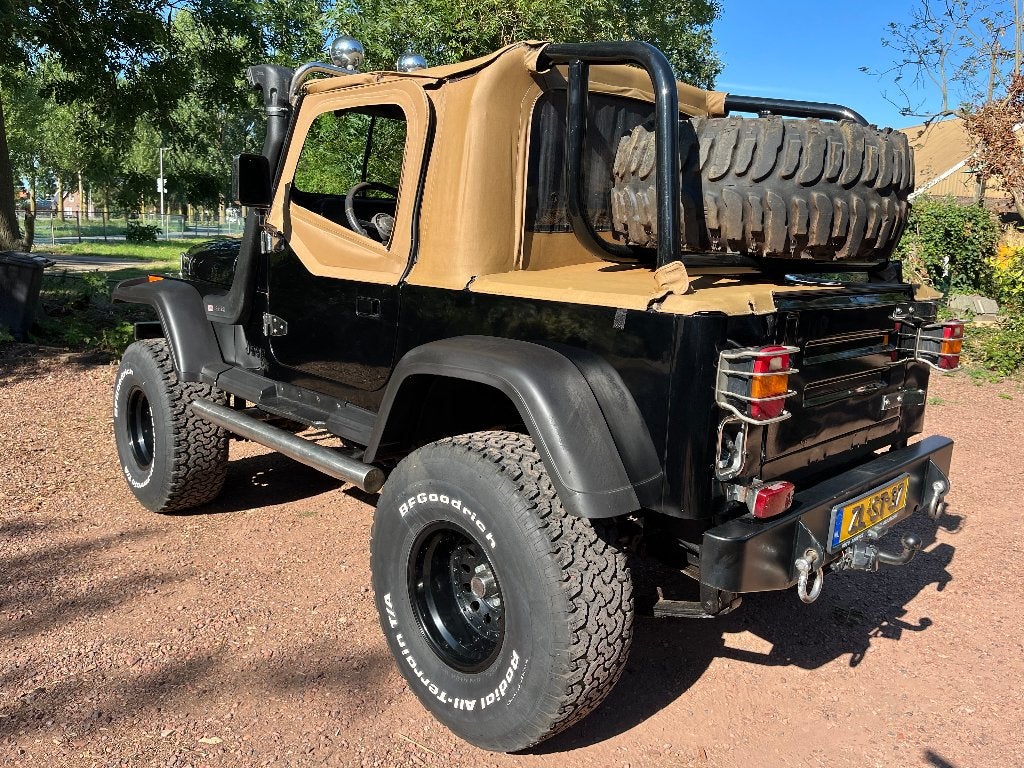 Jeep Wrangler 4.0 I Laredo U9 1992 Zwart, Auto's, Zwart, Zwart, Leder, 3960 cc