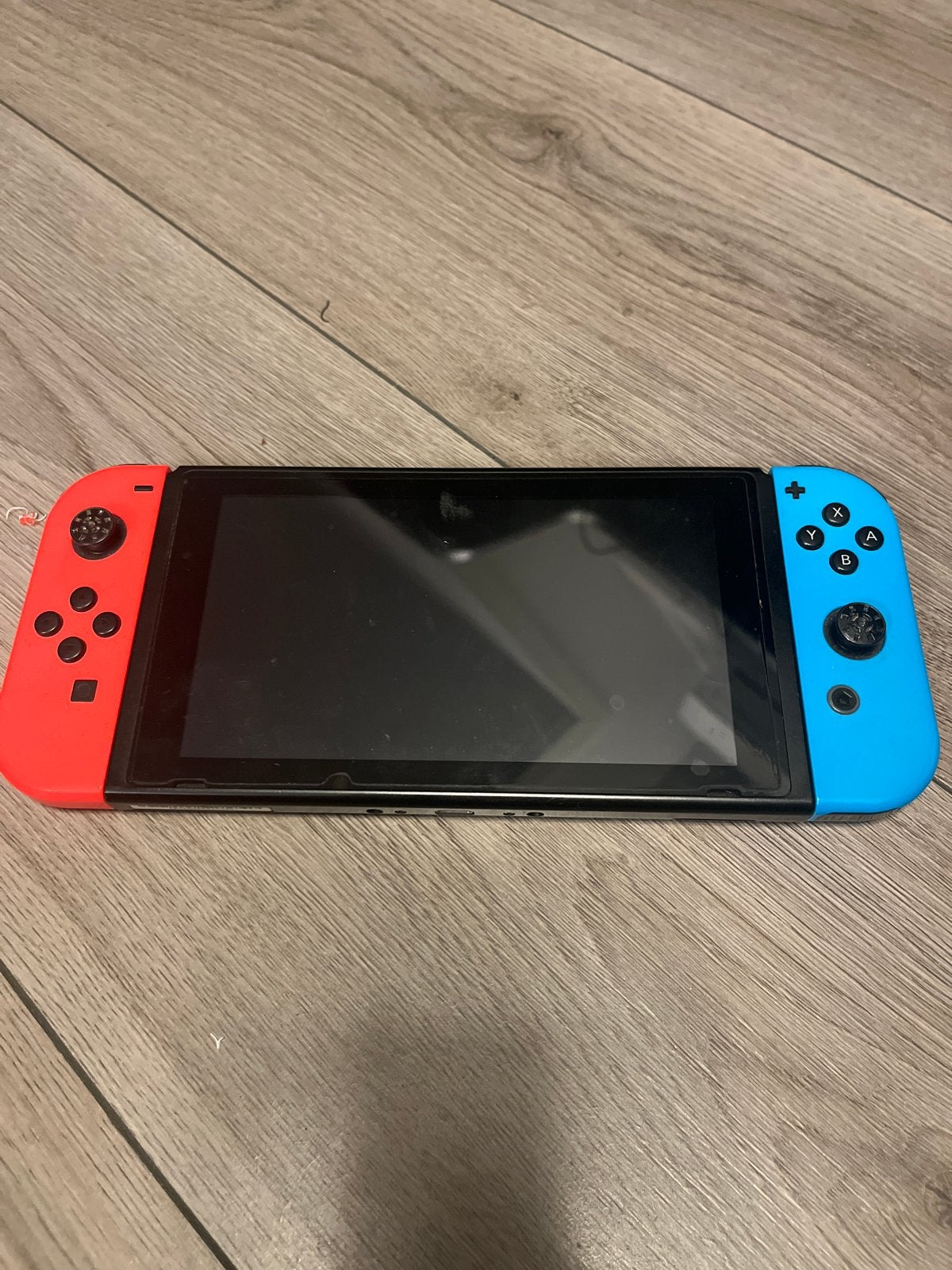 Nintendo Switch met rode en blauwe Joy-Cons, Ophalen of Verzenden, Zo goed als nieuw, Met 2 controllers, Switch Original