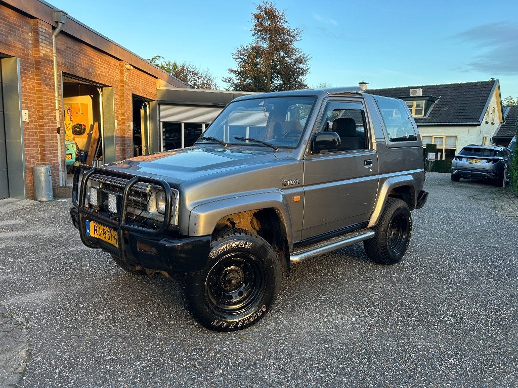 Daihatsu Feroza 1993 Grijs, Auto's, Stof, 4 stoelen, Origineel Nederlands, Bedrijf