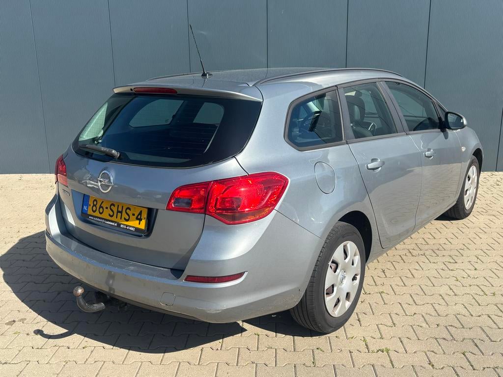 Opel Astra 1.4 74KW ST 2011 Grijs, Auto's, Voorwielaandrijving, 4 cilinders, 100 pk, Origineel Nederlands