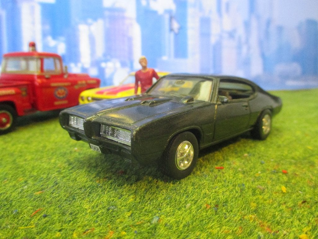 1/43 1969 Pontiac GTO The Judge - ERTL, Hobby en Vrije tijd, Modelauto's | 1:43, Ophalen of Verzenden, Gebruikt, Auto, Overige merken