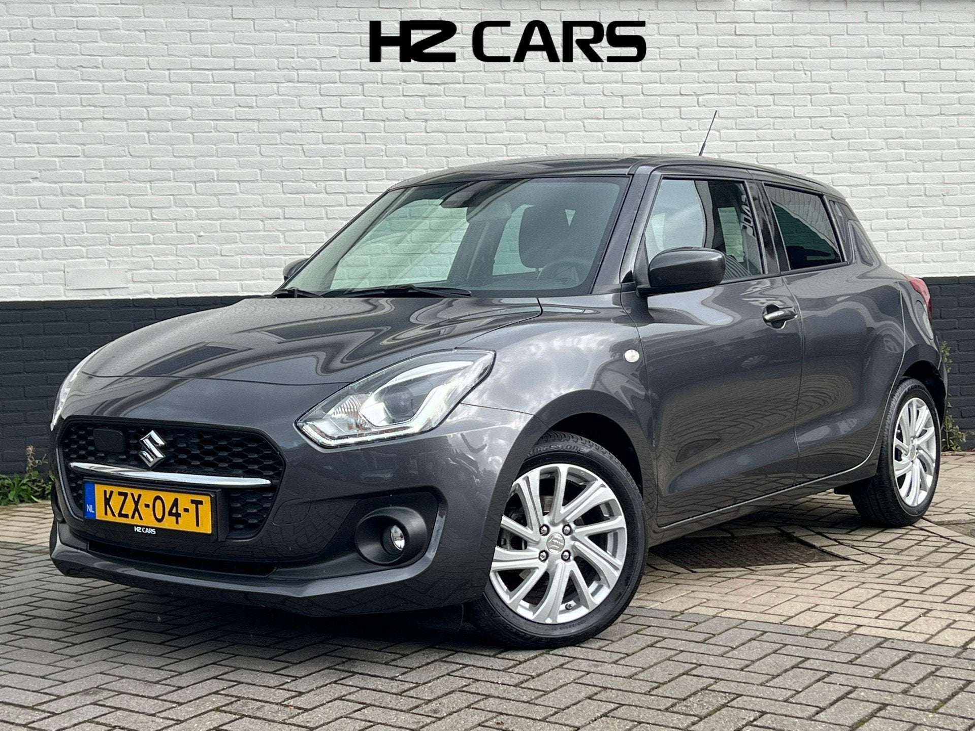 Suzuki Swift 1.2 Select Smart Hybrid|Automaat|Camera|Carplay, Auto's, Stof, Gebruikt, Zwart, 4 cilinders
