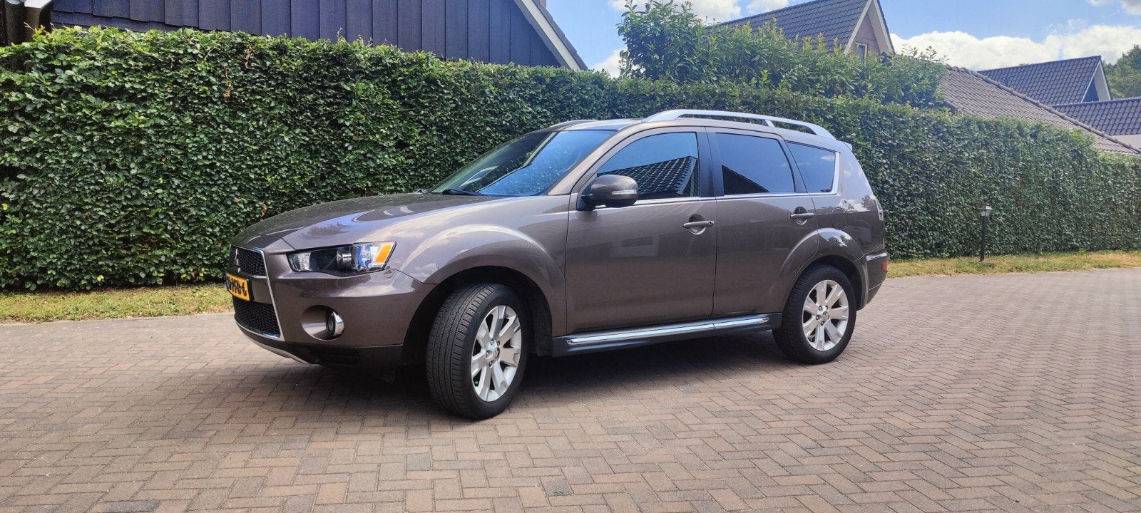 Mitsubishi Outlander 2.0 MPI 2WD 2011, Auto's, 1998 cc, 4 cilinders, Bruin, Leder en Stof