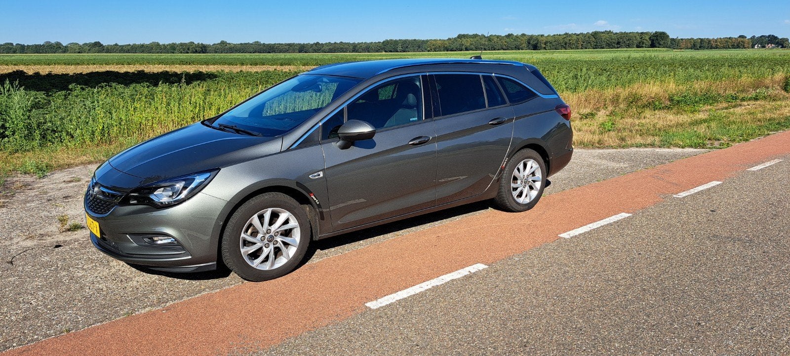 Opel Astra 1.4 Turbo 110KW Sports Tourer 2018 Grijs, Auto's, Voorwielaandrijving, Lane Keeping Assist, 4 cilinders, Origineel Nederlands