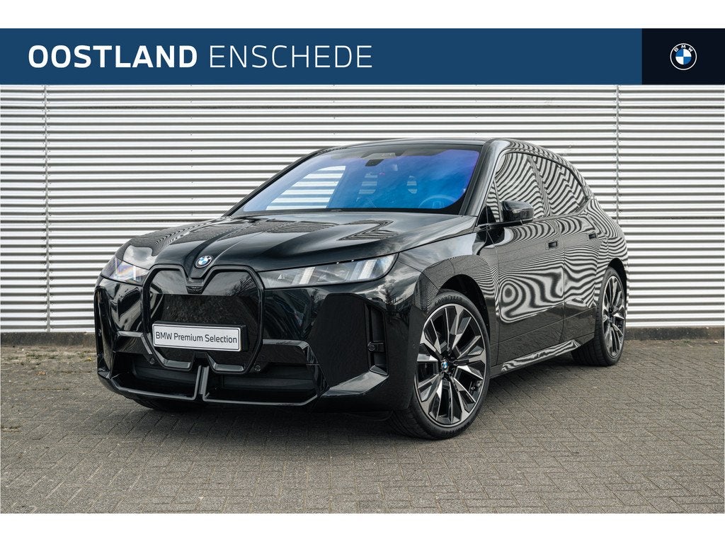 BMW iX xDrive60 M Sport / Panoramadak Sky Lounge / Trekhaak, Auto's, BMW, Automaat, Gebruikt, Zwart, Met garantie (alle)