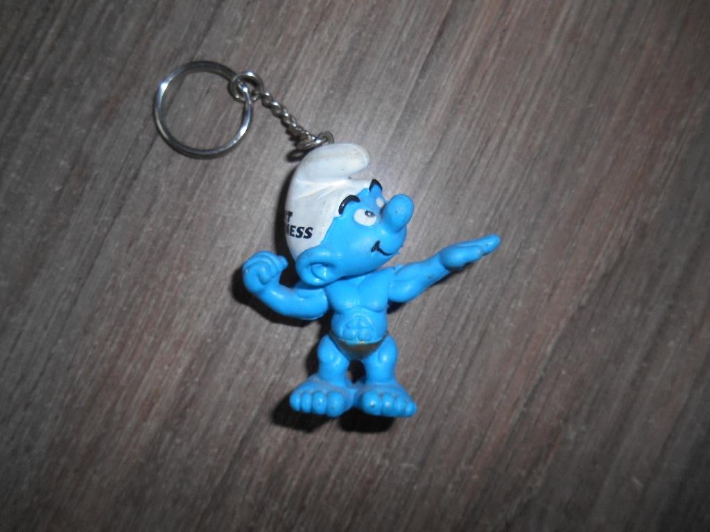 Sport & Fitness smurf sleutelhanger reclamesmurf, Ophalen of Verzenden, Zo goed als nieuw, Overige Smurfen, Poppetje, Figuurtje of Knuffel