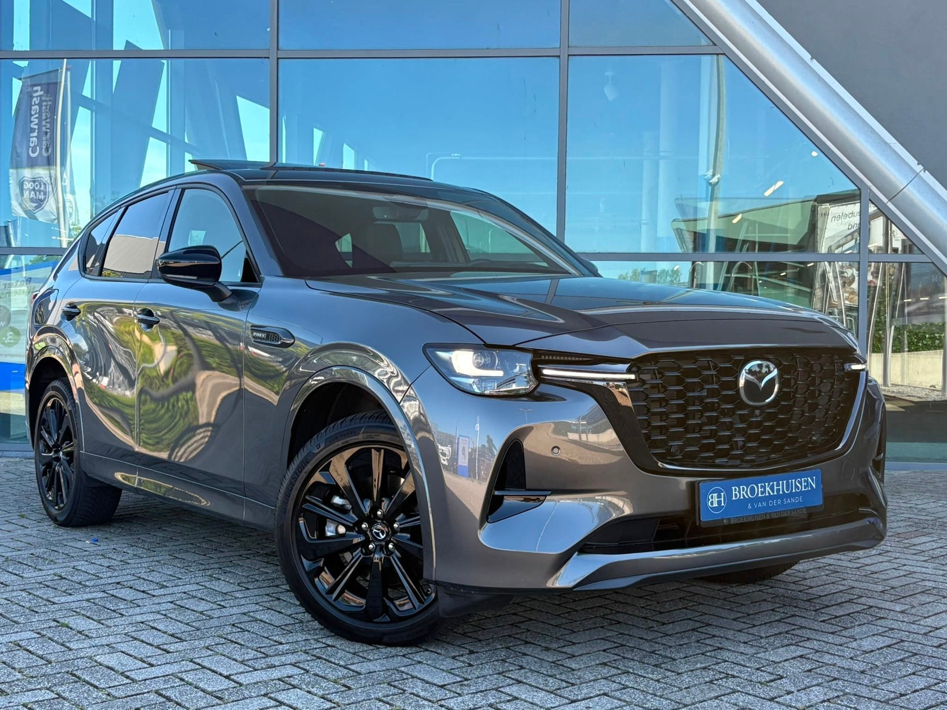 Mazda CX-60 2.5 e-SkyActiv PHEV Homura Plus 327pk Panoramada, Auto's, Mazda, Automaat, Dealer onderhouden, Gebruikt, Zwart