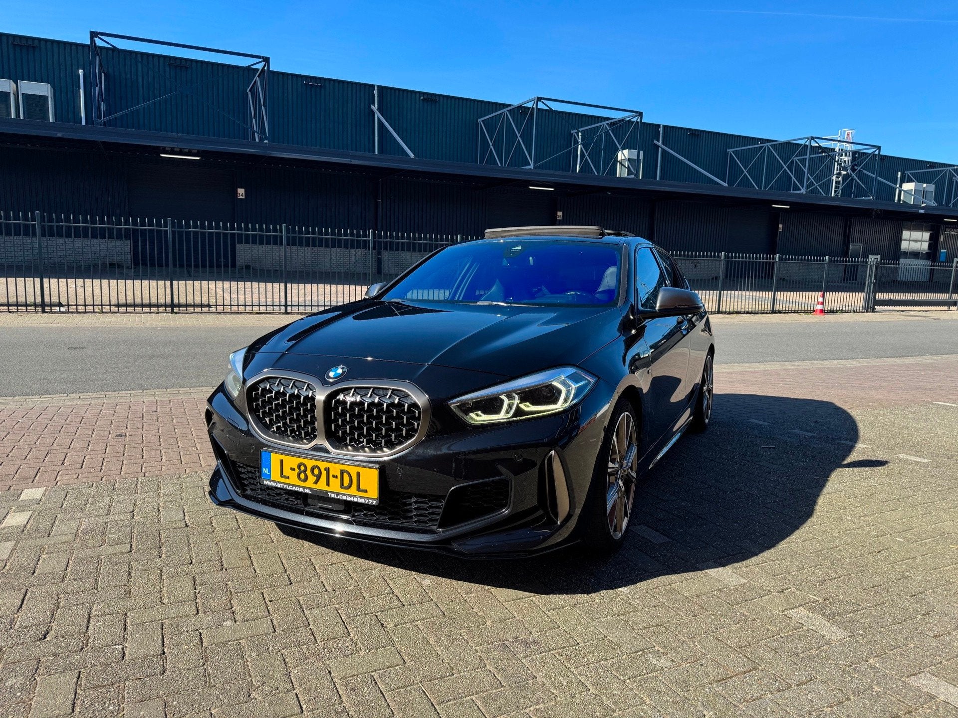 BMW 1-serie M135i xDrive High Executive, Auto's, BMW, 1998 cc, Gebruikt, 4 cilinders, Zwart