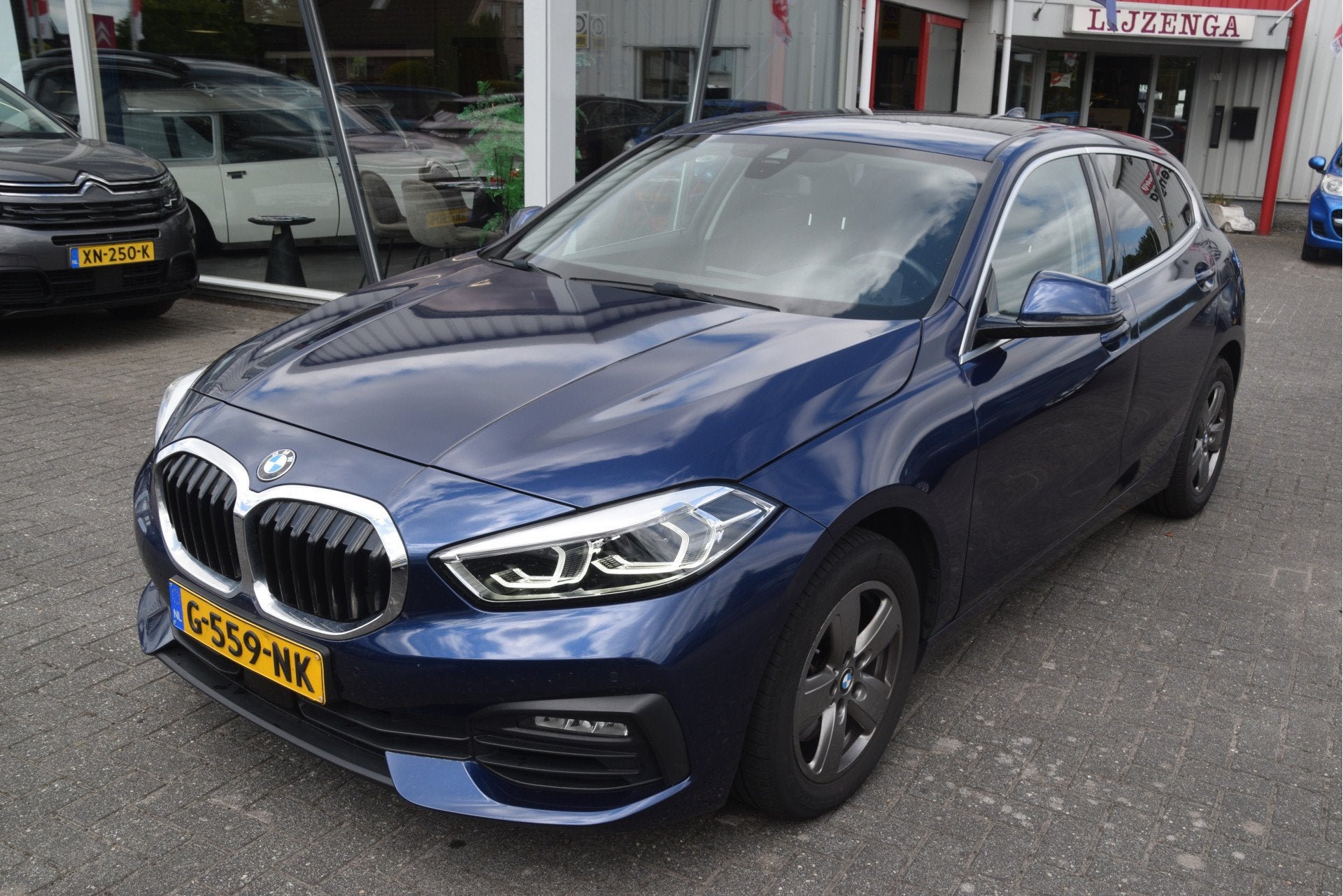 BMW 1-serie 118i Executive Edition LED | Virtual Cockpit | C, Auto's, Stof, Gebruikt, Met garantie (alle), Blauw