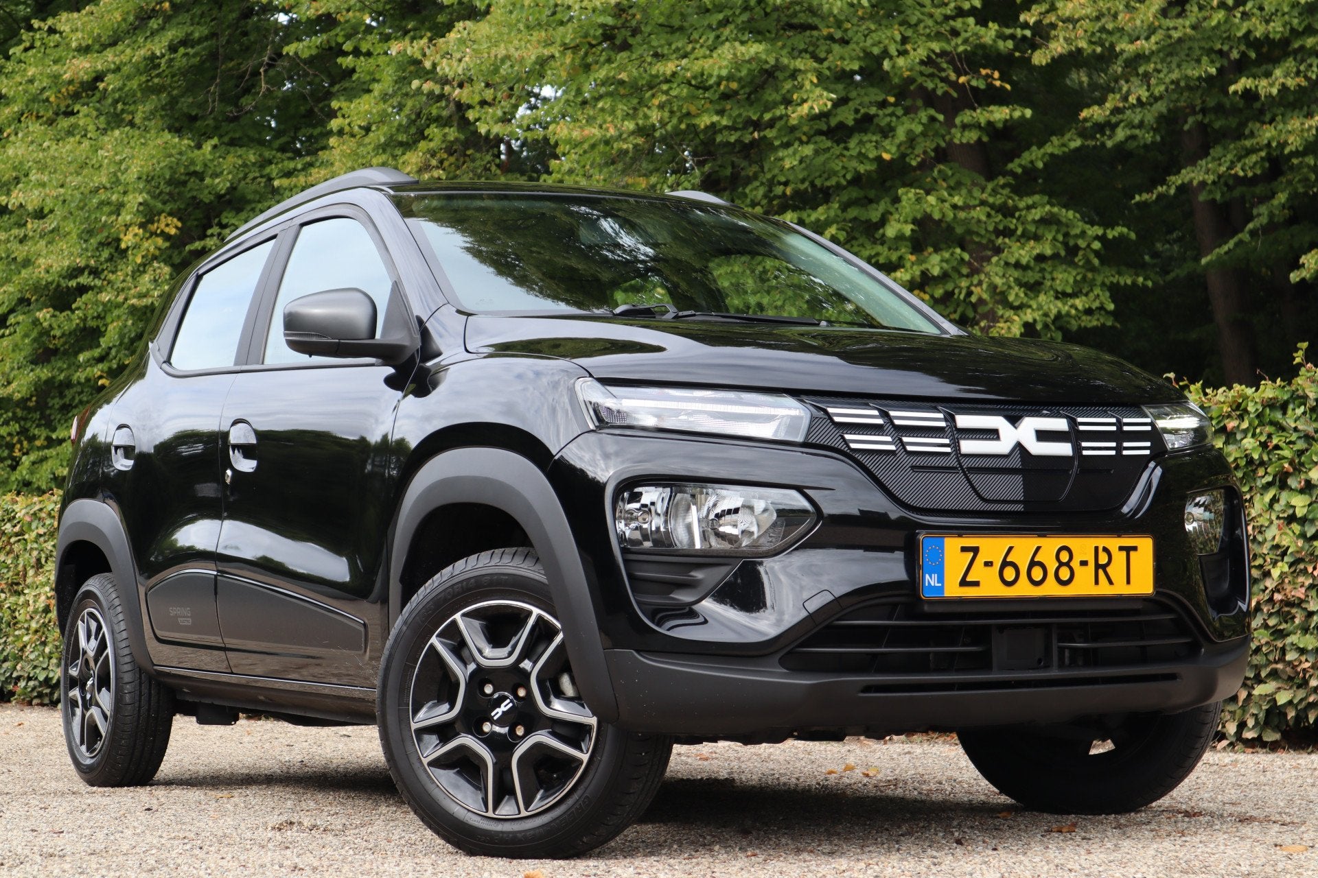 Dacia Spring Expression 27 kWh | Carplay | Camera | Lederen, Auto's, Dacia, 12 maanden, Gebruikt, 234 min, Zwart