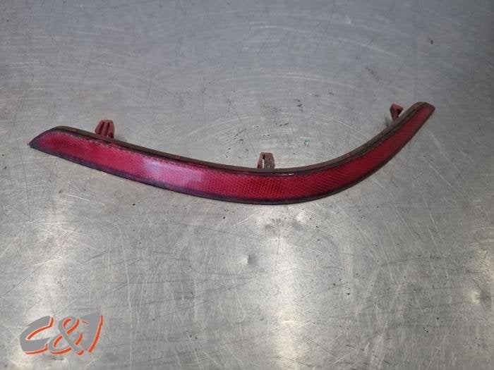 Bumper reflector links-achter van een Volkswagen Caddy