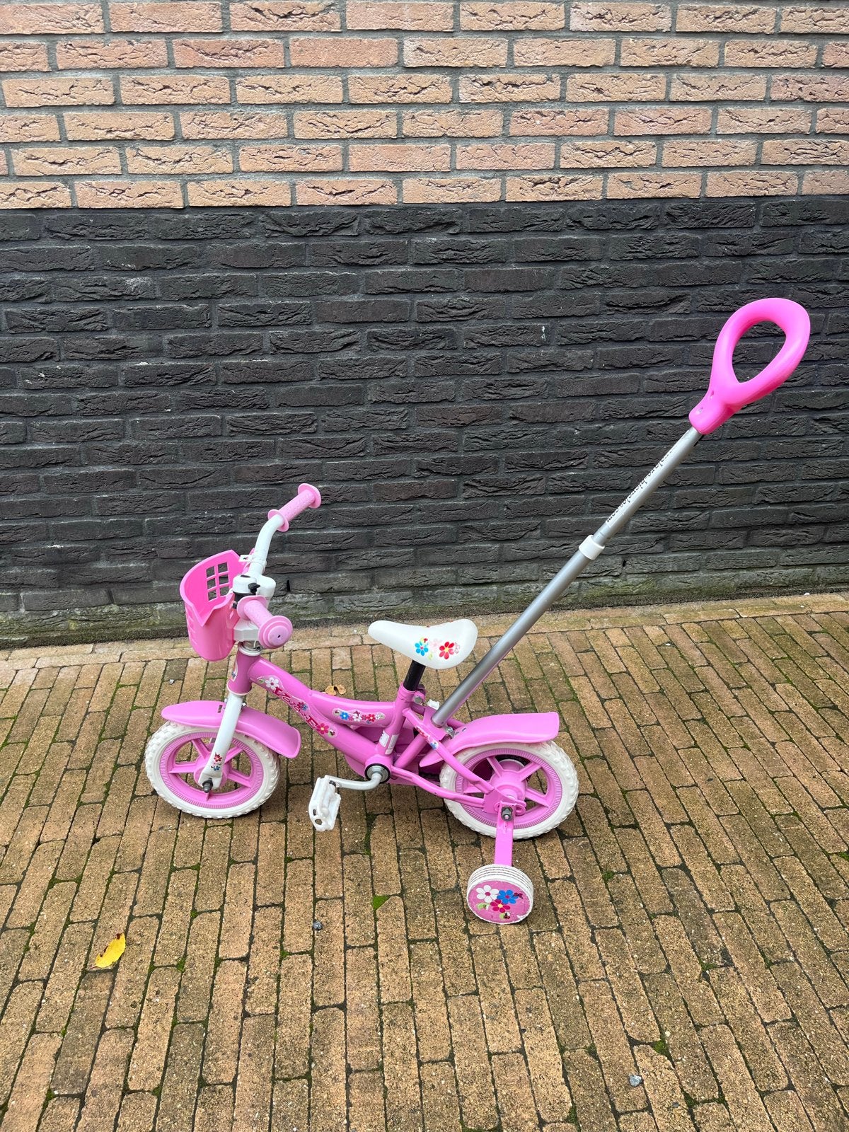 Roze Kinderfiets met of zonderzijwieltjes en duwstang, Ophalen, Terugtraprem, Zijwieltjes, Gebruikt