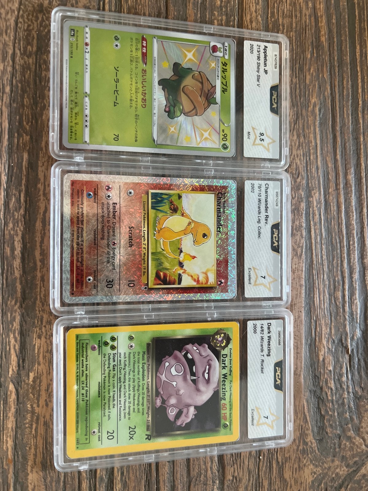 3x PSA Graded Pokémon Kaarten: Appletun, Charmander, Weezing, Ophalen of Verzenden, Zo goed als nieuw, Meerdere kaarten
