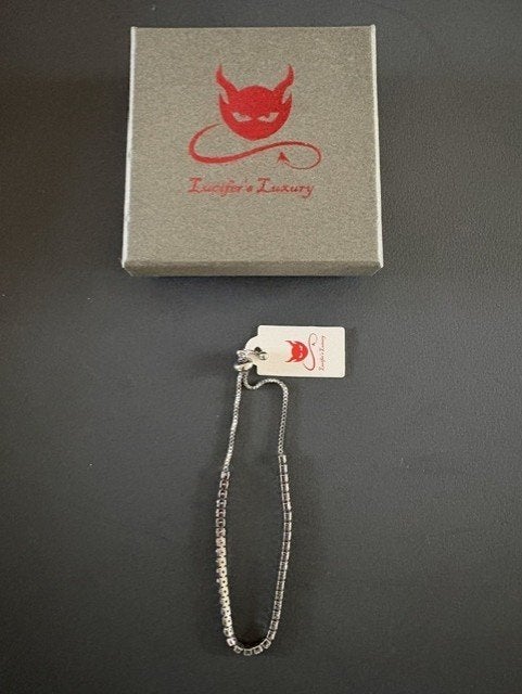 Lucifer's Luxury tennisarmband met heldere kristallen, Ophalen of Verzenden, Nieuw, Zilver, Met strass