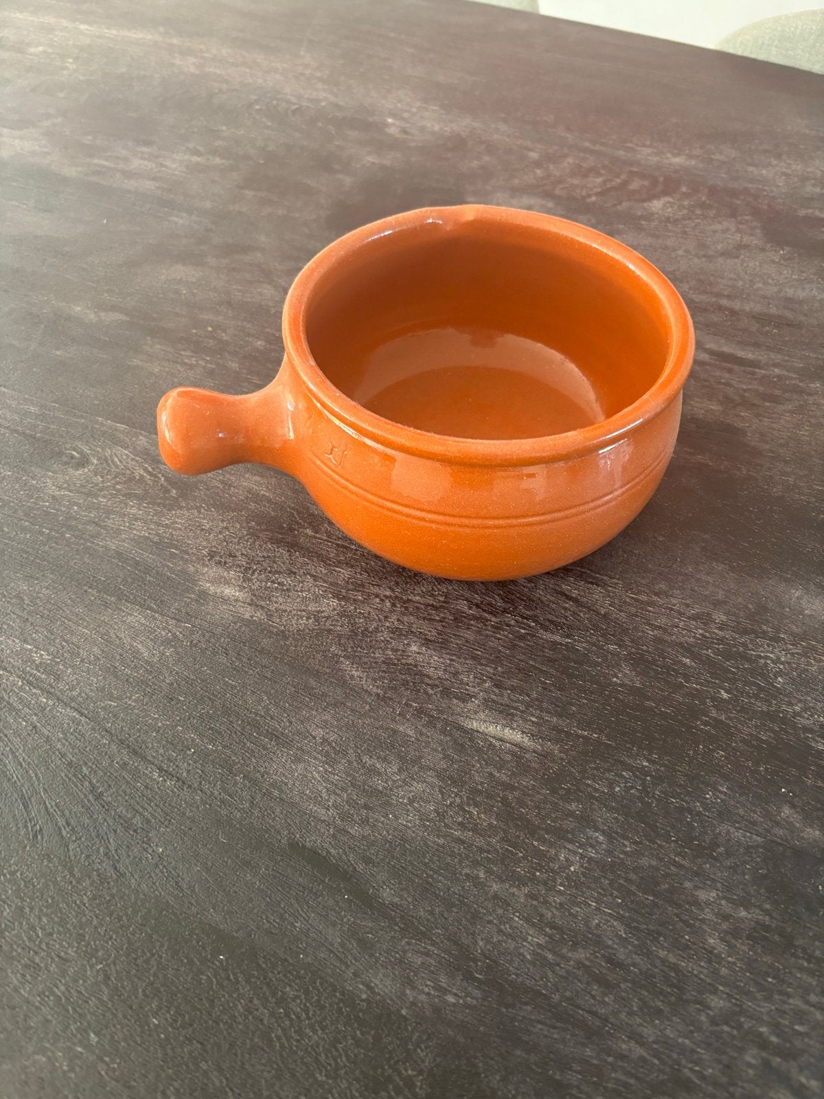 Aardewerken fondue pan, Ophalen