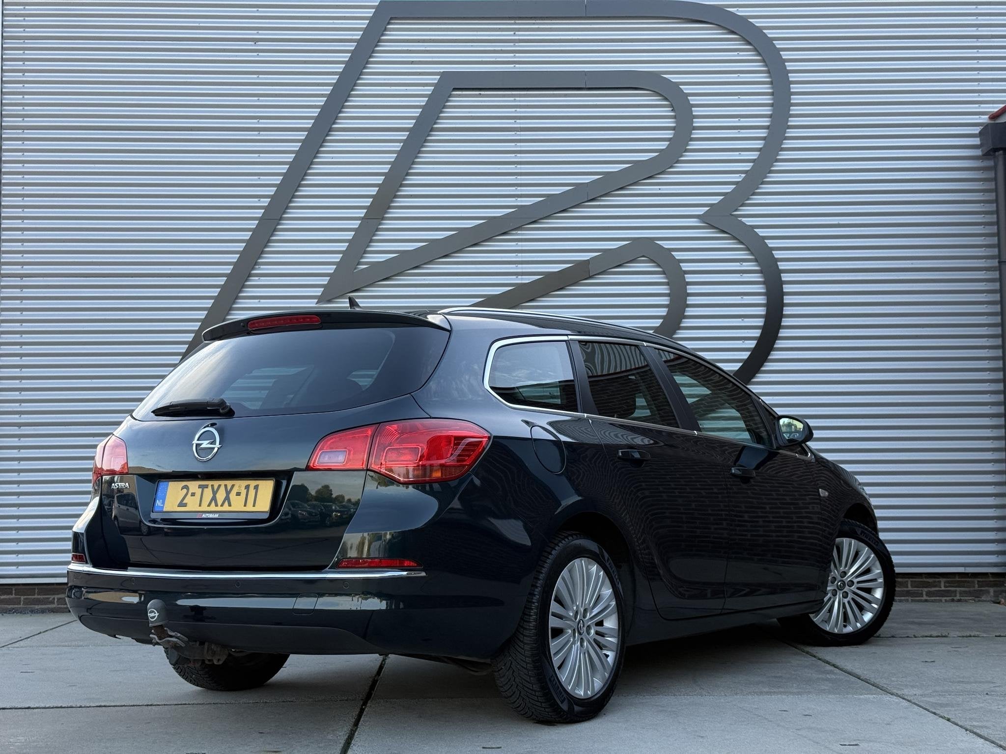 Opel Astra Sports Tourer 1.4 Turbo Design Edition Navi|Camer, Auto's, Voorwielaandrijving, Euro 5, Stof, Gebruikt