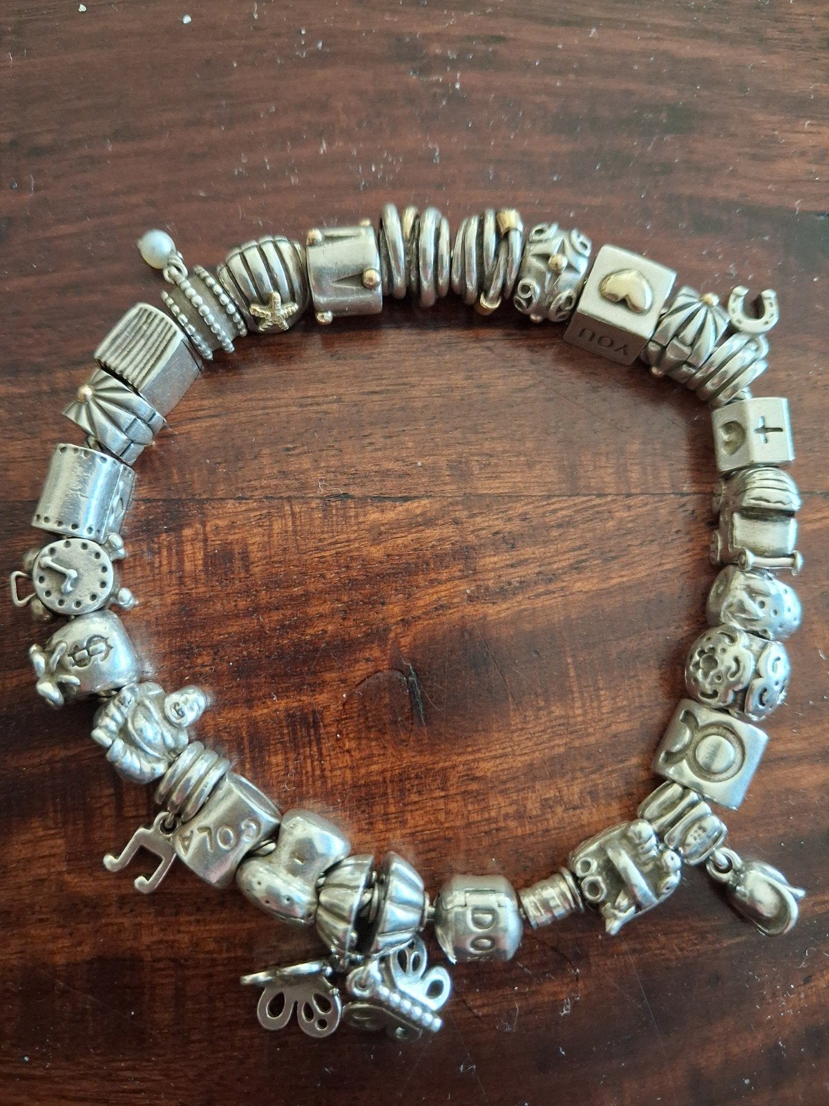 Pandora armband met 27 bedels, waarvan 8 met goud, Ophalen of Verzenden