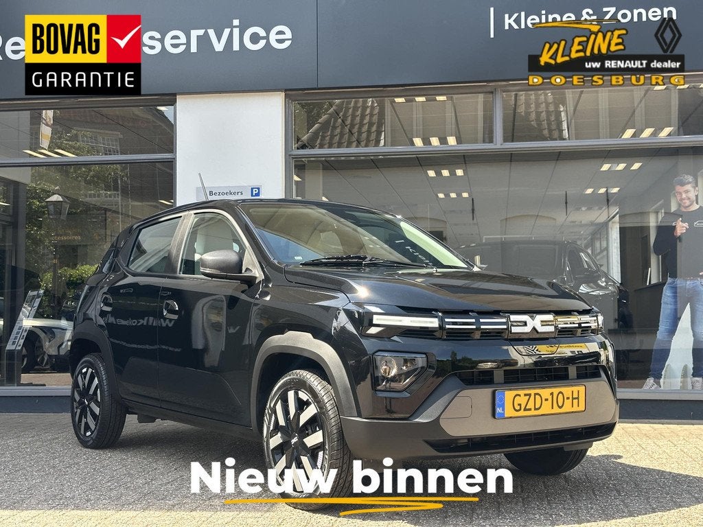 Dacia Spring Expression 65 26.8 kWh | DC lader met een maxim, Auto's, Stof, Gebruikt, 4 stoelen, Zwart