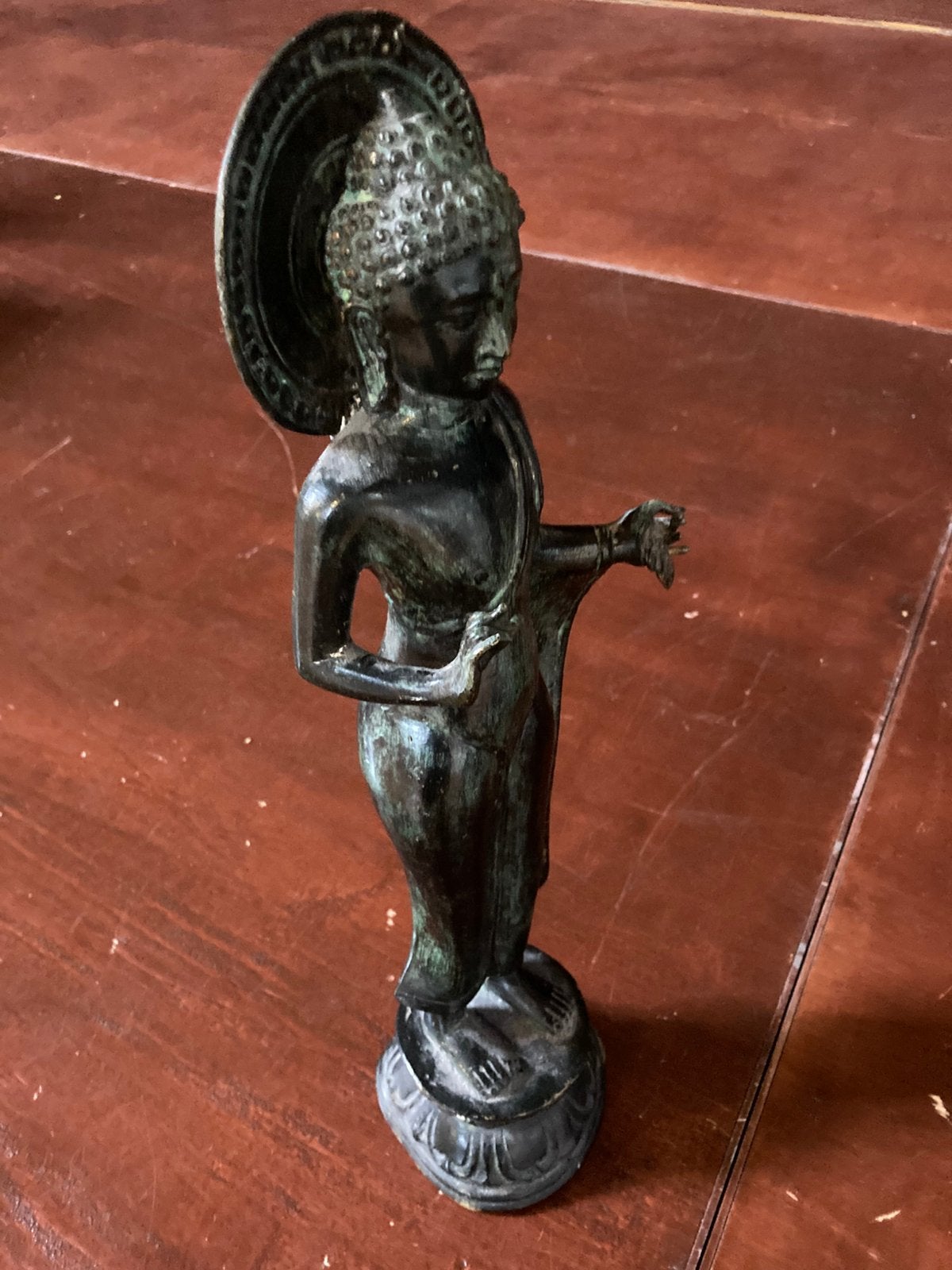 Bronze Boeddha beeld, Ophalen