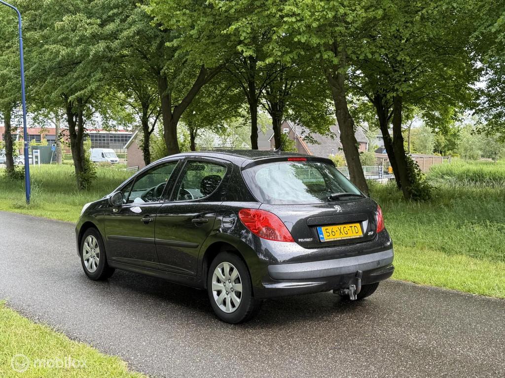 Peugeot 207 1.4 Color-line*1E EIGENAAR*NEW APK*AIRCO*TREKHAA, Auto's, Voorwielaandrijving, Stof, Zwart, 4 cilinders