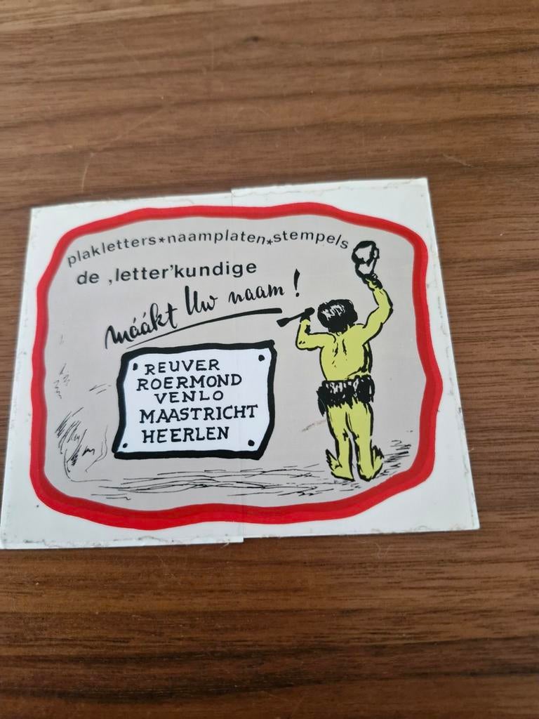 7768 Vintage Reuver Reclame Sticker - Plakletters Stempels, Ophalen of Verzenden, Gebruikt