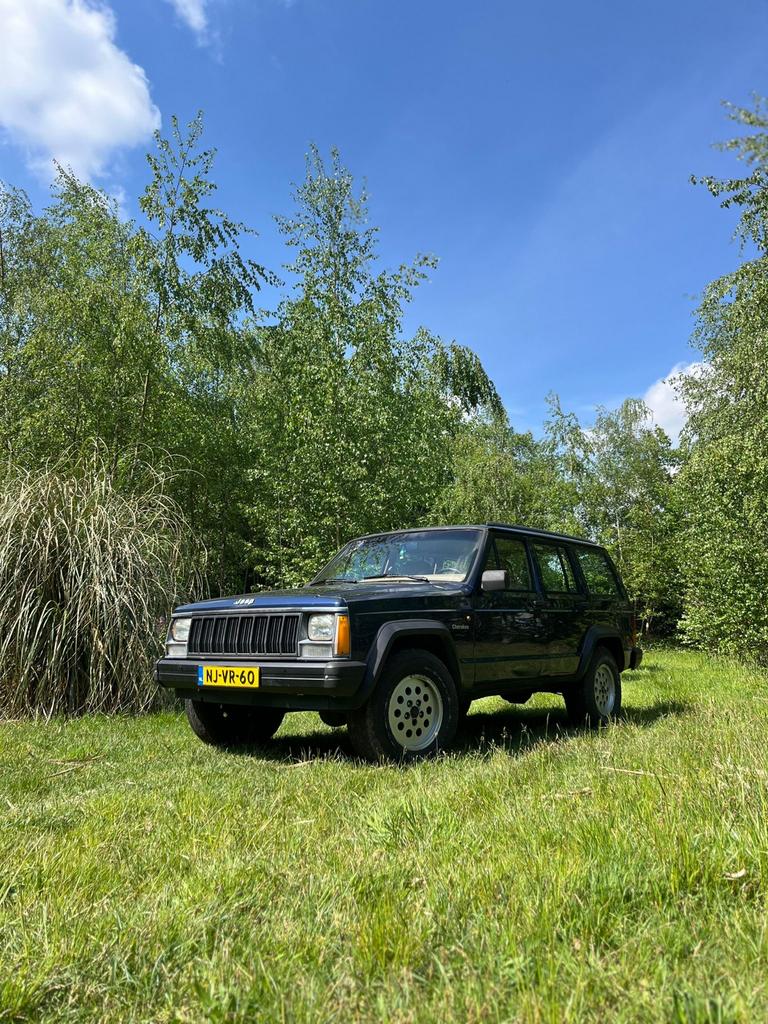 Jeep Cherokee 4.0 I SE AUT 4WD 1996 Blauw, Auto's, Automaat, Stof, Blauw, Origineel Nederlands