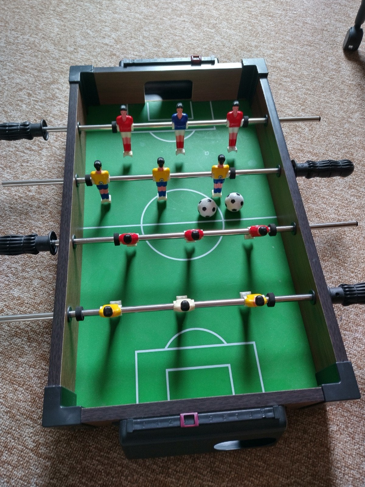 Voetbalspel voor op de tafel, Ophalen