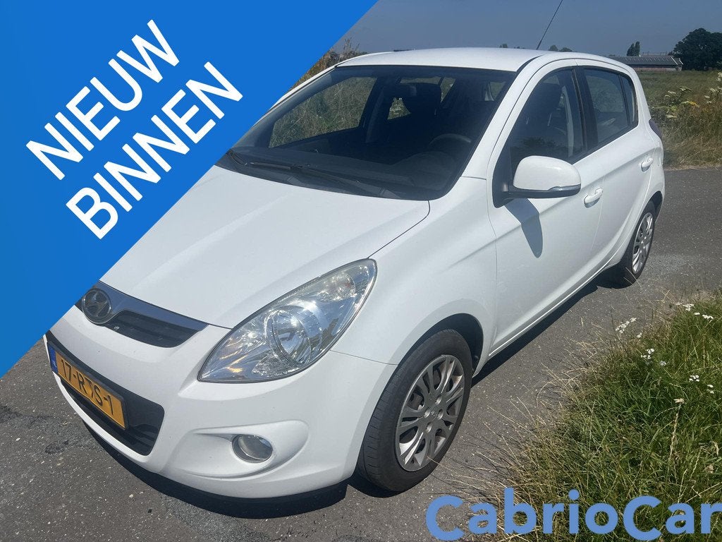 Hyundai i20 1.4i i-Motion Garantie Automaat, Auto's, Hyundai, Euro 5, 4 cilinders, 1396 cc, Wit