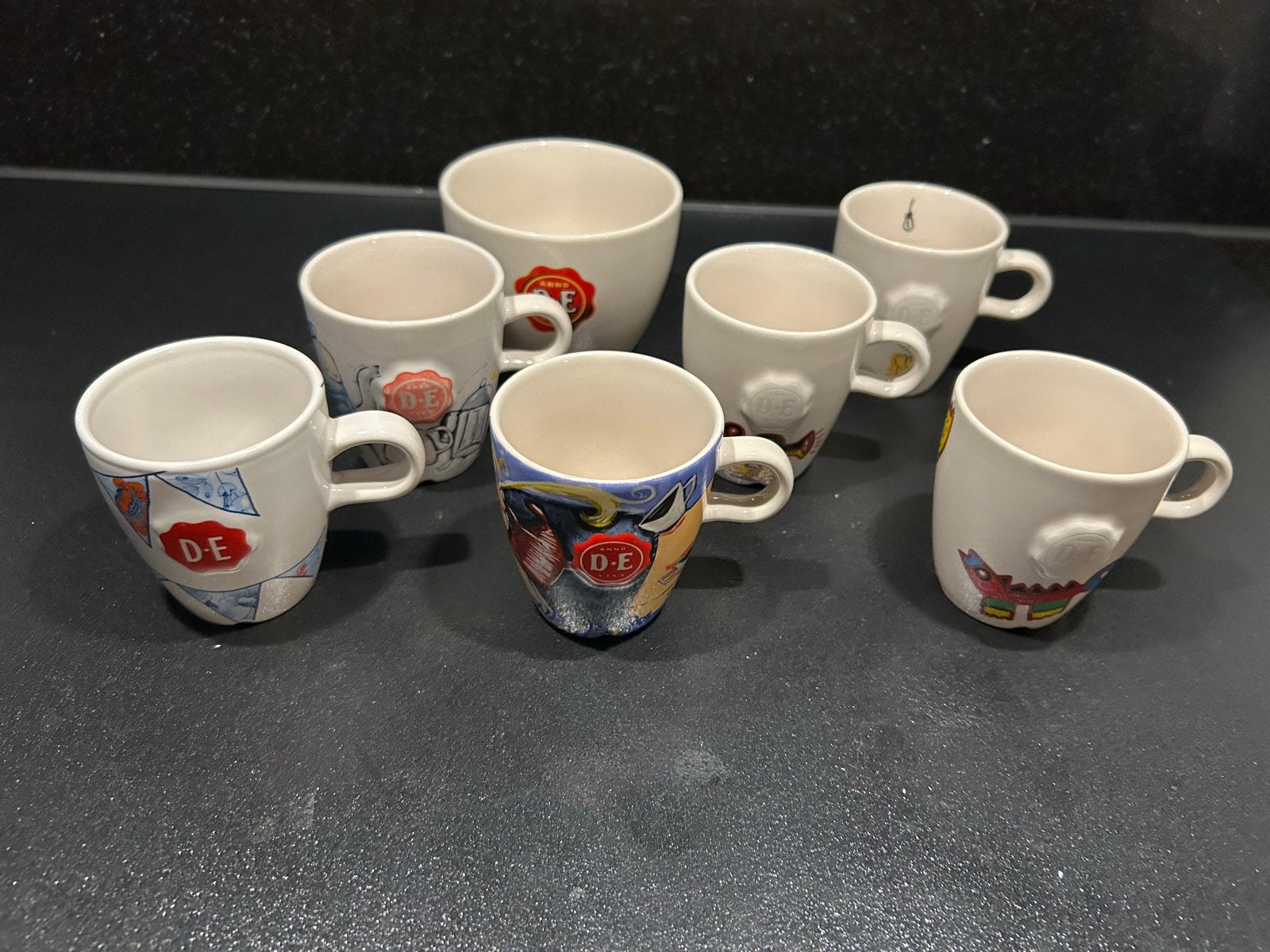 Douwe Egberts D.E. spaar mokken - 7 stuks, Gebruikt, Overige merken, Keramiek, Overige stijlen