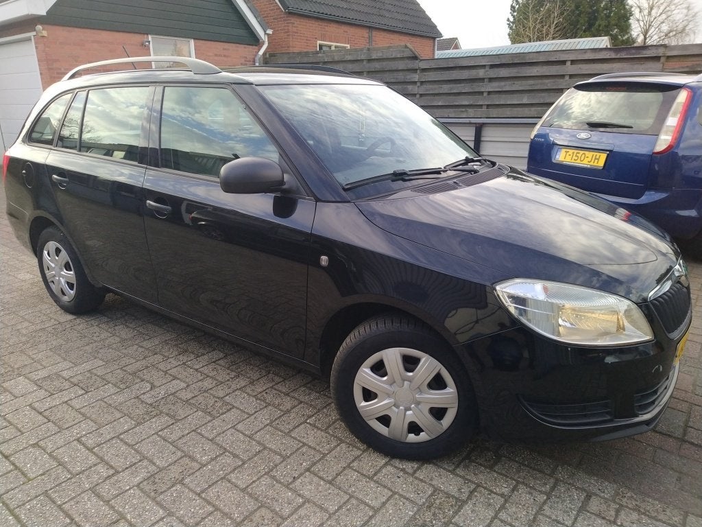 Skoda Fabia Combi 1.2-12V Fresh (bj 2012), Auto's, Voorwielaandrijving, Euro 5, 1198 cc, Zwart