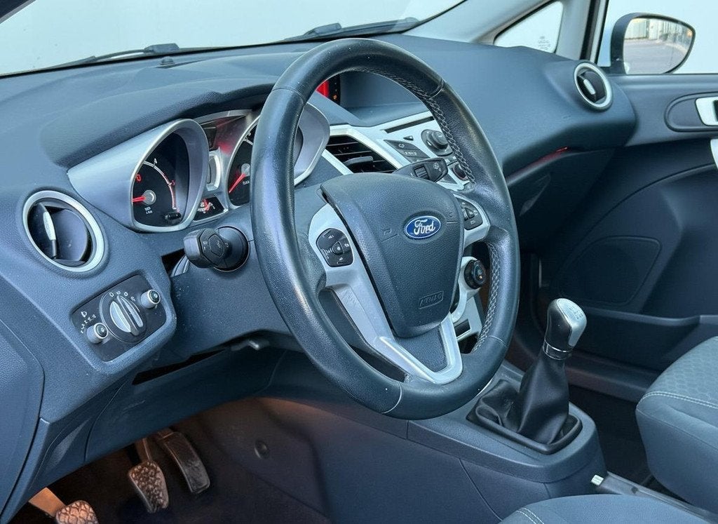 Ford Fiesta 1.6 TDCi ECOnetic Lease Titanium Airco Cruise 12, Auto's, Voorwielaandrijving, Stof, Gebruikt, Zwart