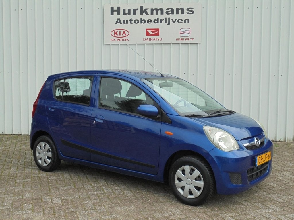 Daihatsu Cuore 1.0 69Pk 5drs Premium Automaat (bj 2009), Auto's, Automaat, 12 maanden, Stof, Zwart