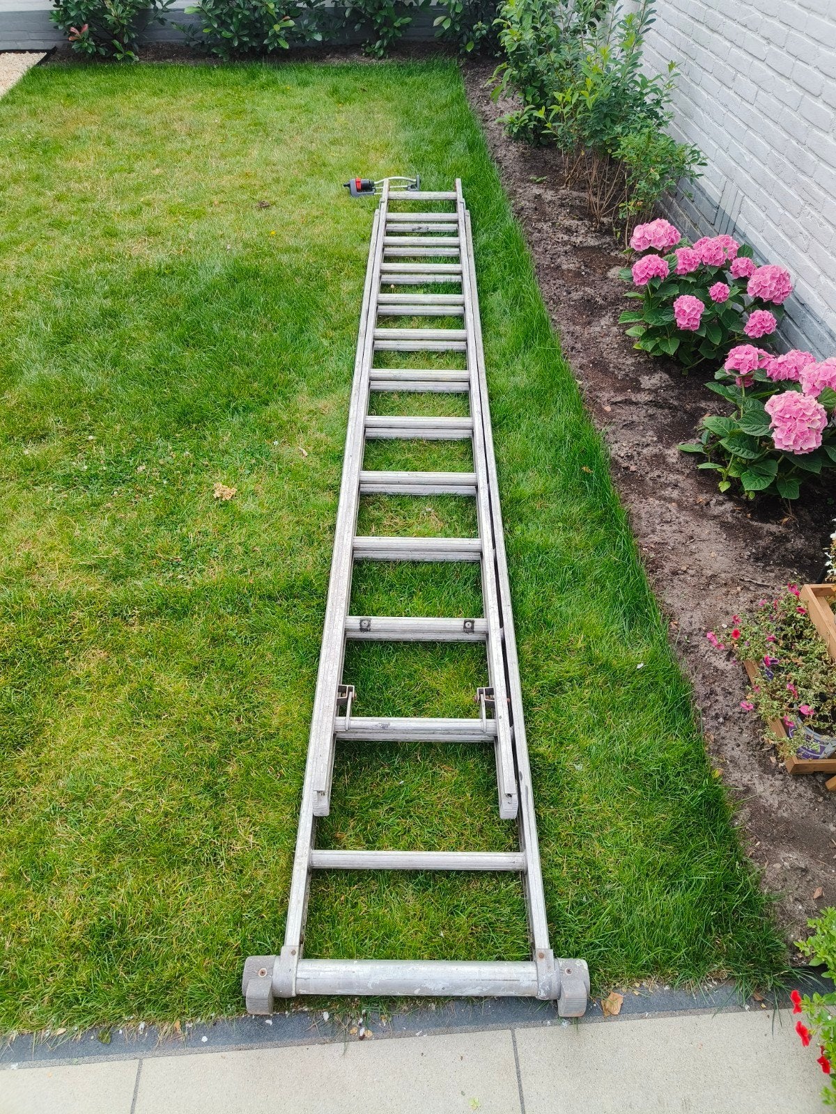 Uitschuifladder 2x12, Doe-het-zelf en Verbouw, Ladders en Trappen, Ophalen, Gebruikt, Minder dan 2 meter
