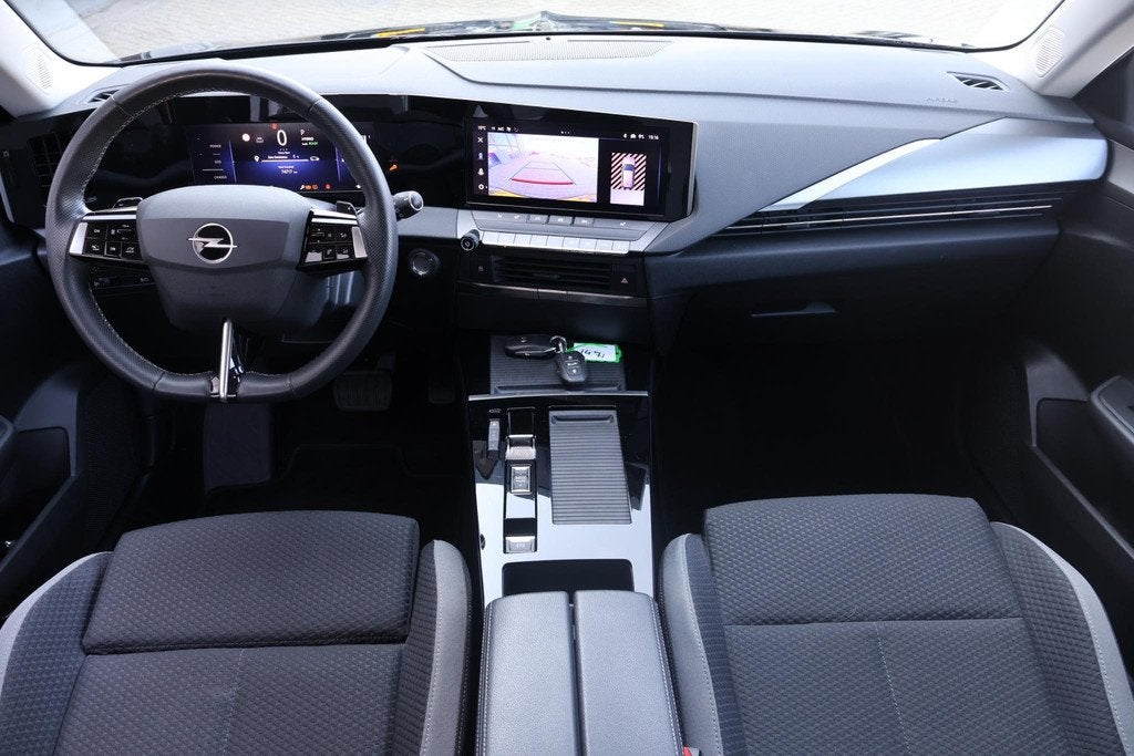 Opel Astra 1.6 Hybrid Business Edition 1e Eigenaar | Volledi, Auto's, Stof, Gebruikt, 4 cilinders, 181 pk