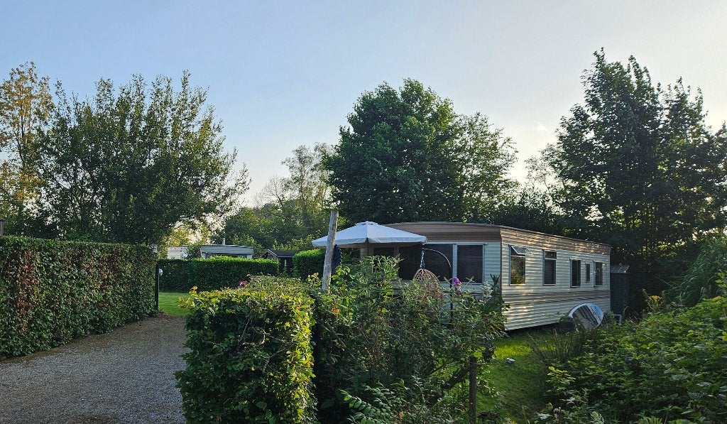 Stacarvan met staanplaats camping Meerzicht Midlaren, Caravans en Kamperen, Tot en met 6