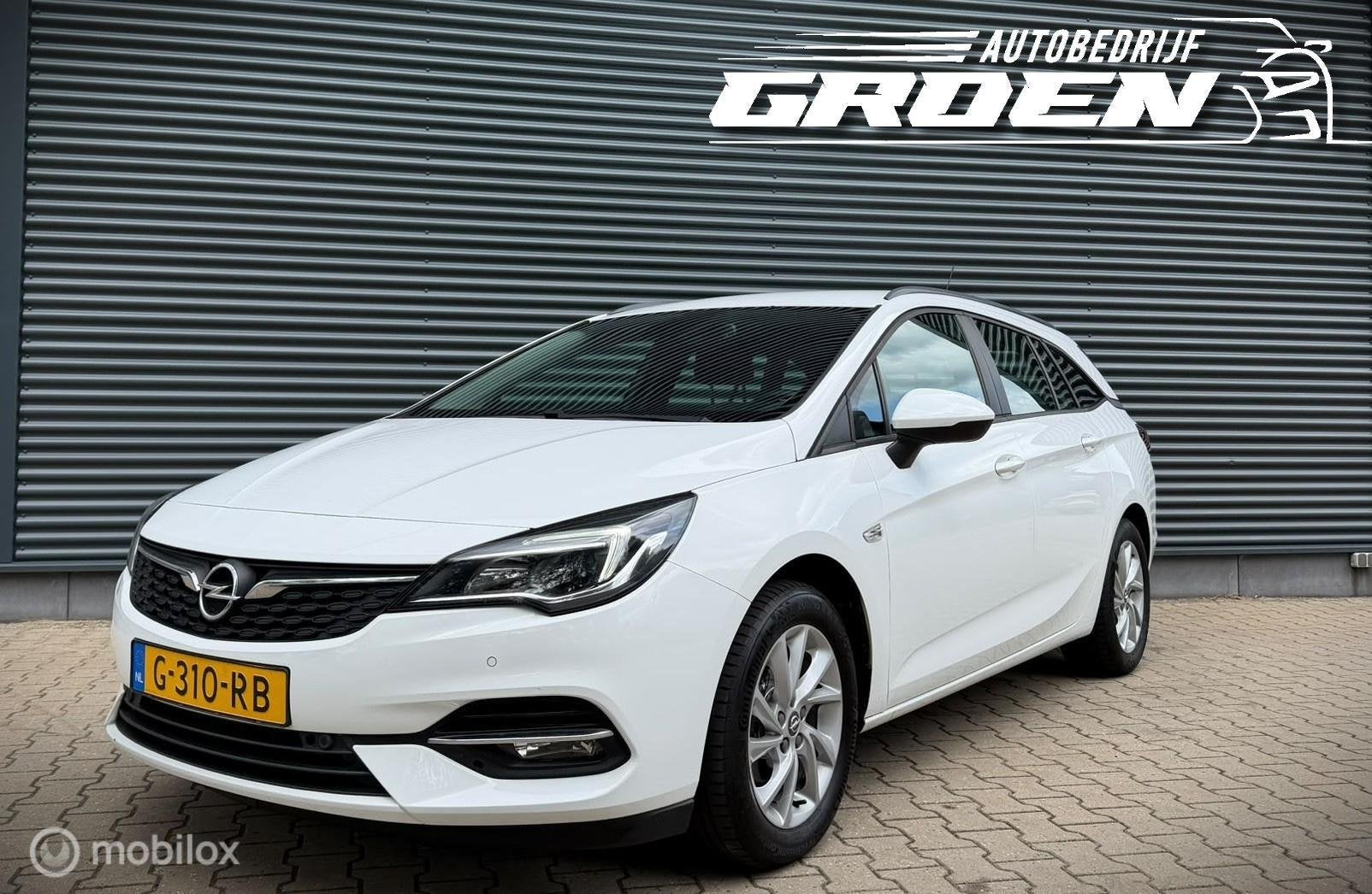 Opel Astra Sports Tourer 1.2 Edition NAP|TREKHAAK|PDC|CAMERA, Gebruikt, Euro 6, 1199 cc, Wit