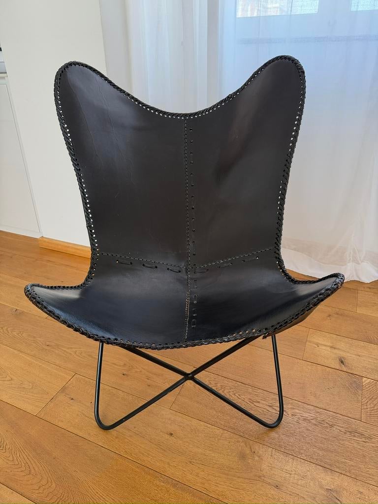 Zwart leren vlinderstoel, Huis en Inrichting, Fauteuils, Ophalen, Nieuw, Leer, 50 tot 75 cm