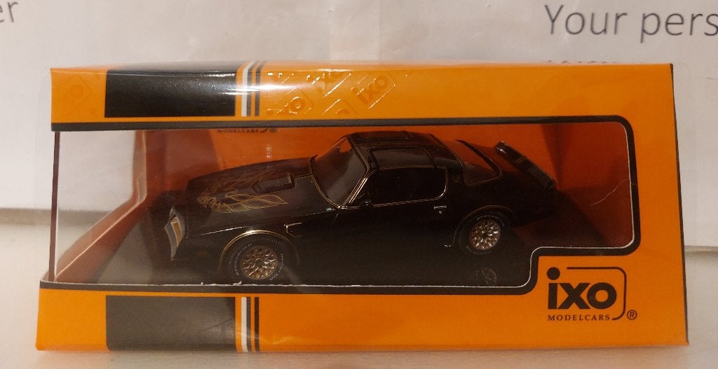 Ixo 1:43 Pontiac Firebird Trans Am 1977 zwart/goud nieuw, Ophalen of Verzenden, Nieuw, Auto, Overige merken