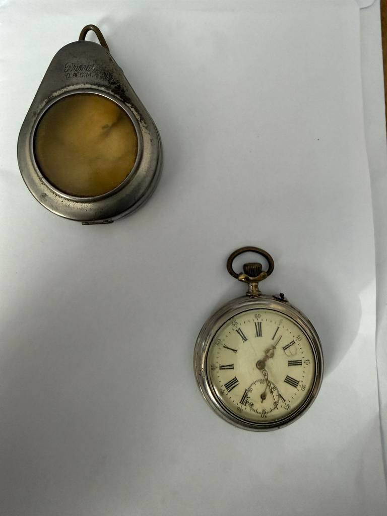 Zakhorloge Primut DRGM in metalen beschermhouder., Ophalen, Staal, Overige merken