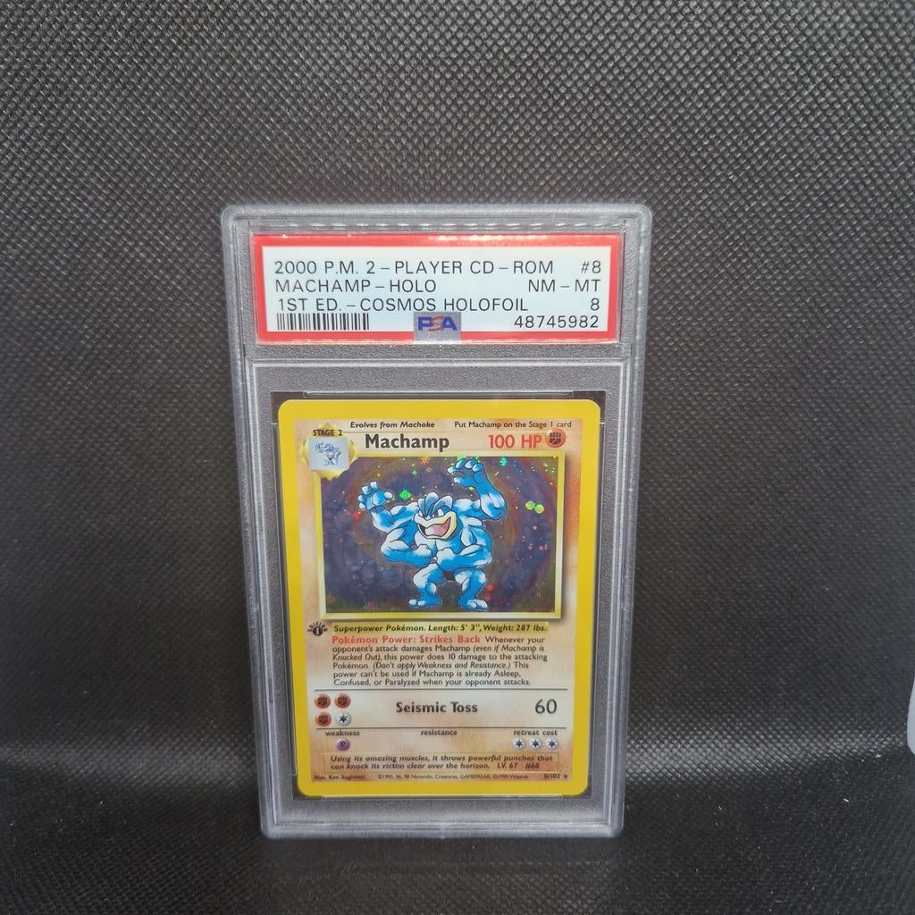 Machamp Holo 1st Edition Cosmos Holofoil PSA 8, Hobby en Vrije tijd, Ophalen of Verzenden, Zo goed als nieuw