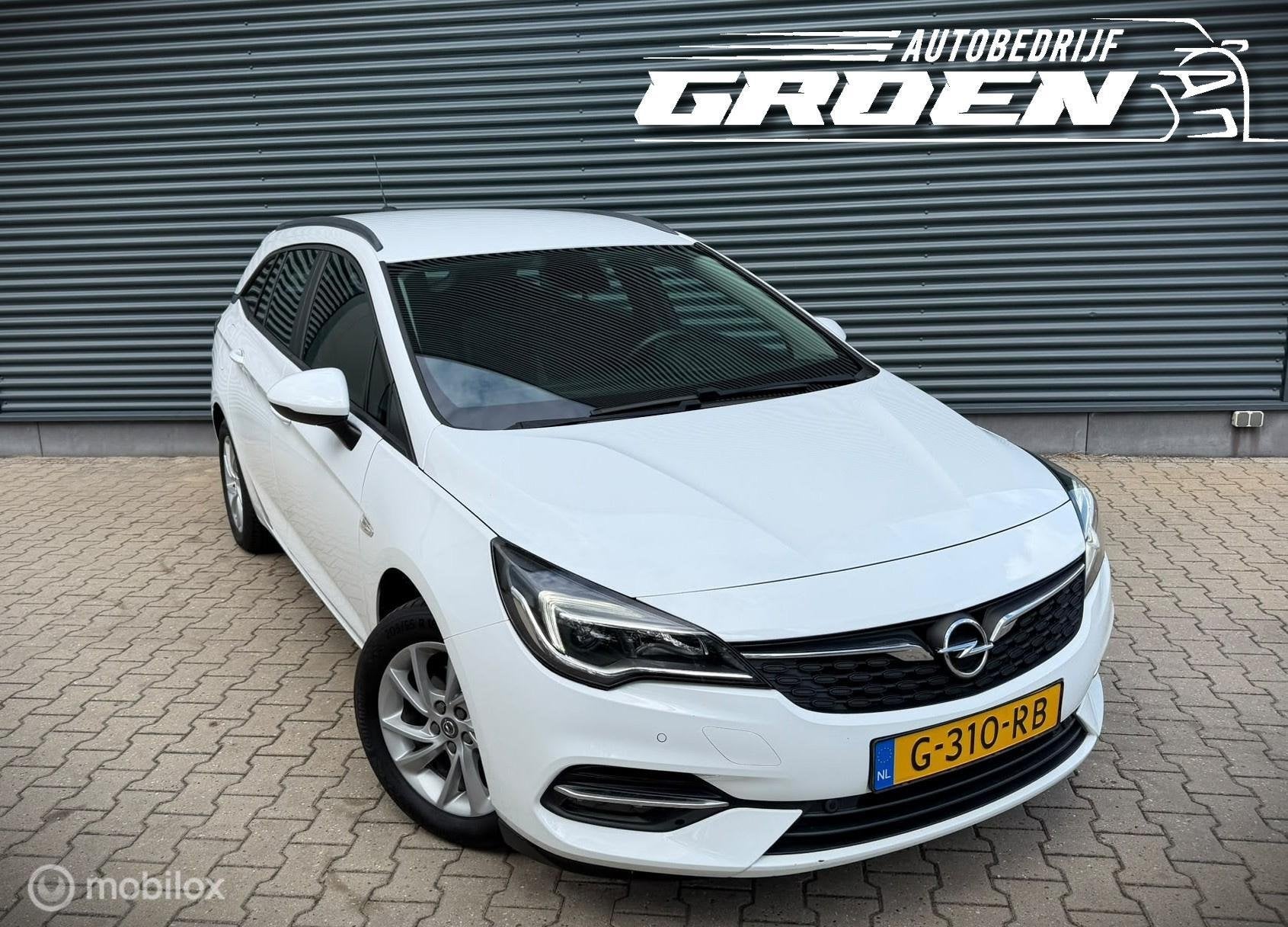 Opel Astra Sports Tourer 1.2 Edition NAP|TREKHAAK|PDC|CAMERA, Gebruikt, Euro 6, 1199 cc, Wit