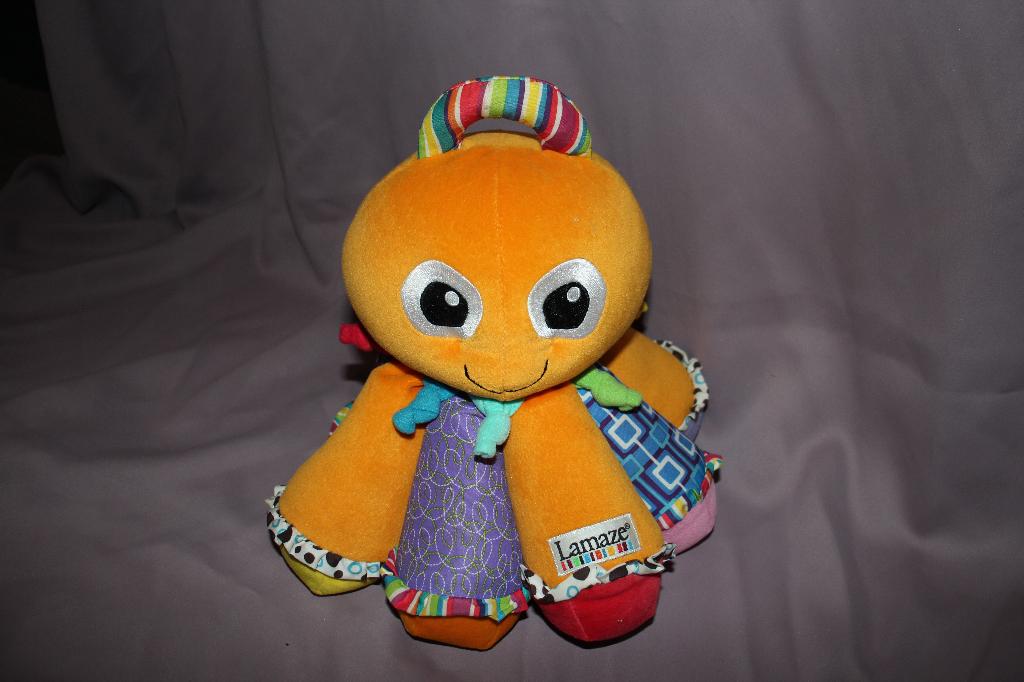 Lamaze Octotunes muzikale octopus knuffel - 30cm, Kinderen en Baby's, Speelgoed | Knuffels en Pluche, Ophalen of Verzenden, Zo goed als nieuw
