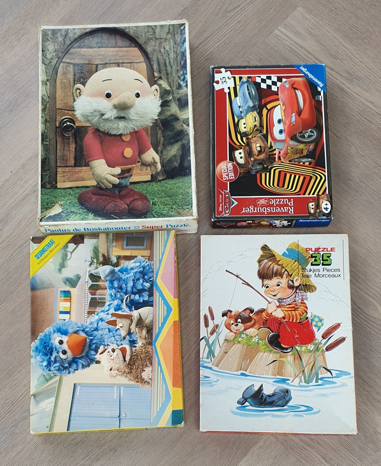4 puzzels: Paulus de Boskabouter, Cars, Sesamstraat, Visser, Ophalen, 10 tot 50 stukjes, Gebruikt, 4 tot 6 jaar